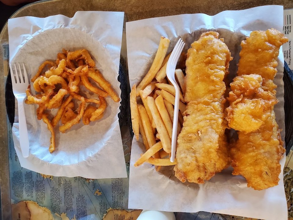 Printed menu for fish, oysters, and chips.