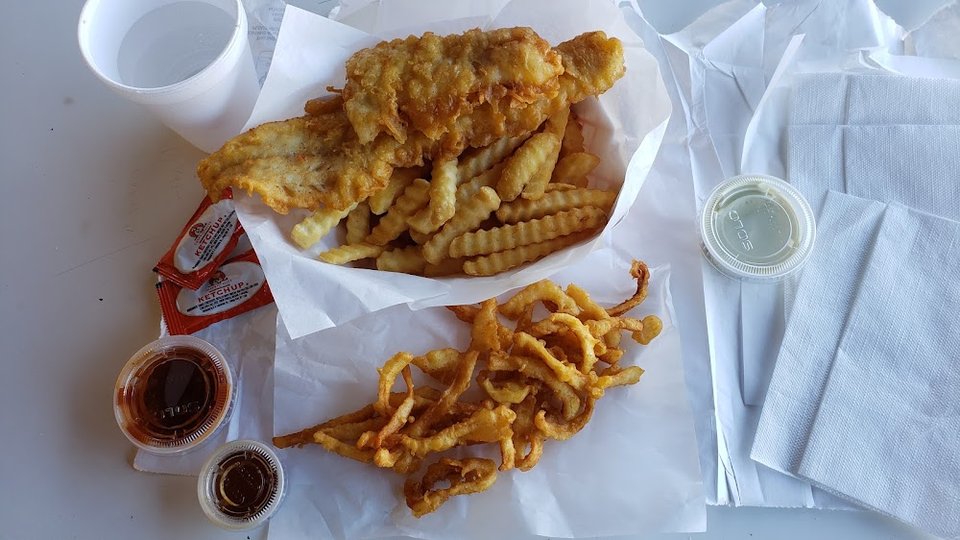 Printed menu for fish, oysters, and chips.