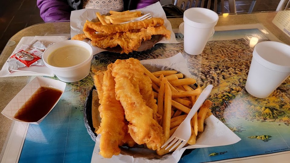 Printed menu for fish, oysters, and chips.